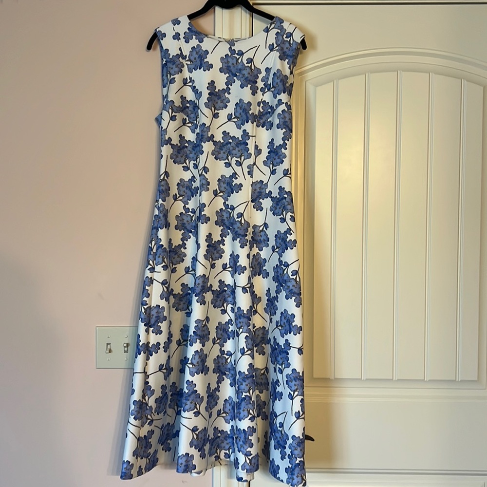 White and Blue flowered dress tapered to fit wearer.